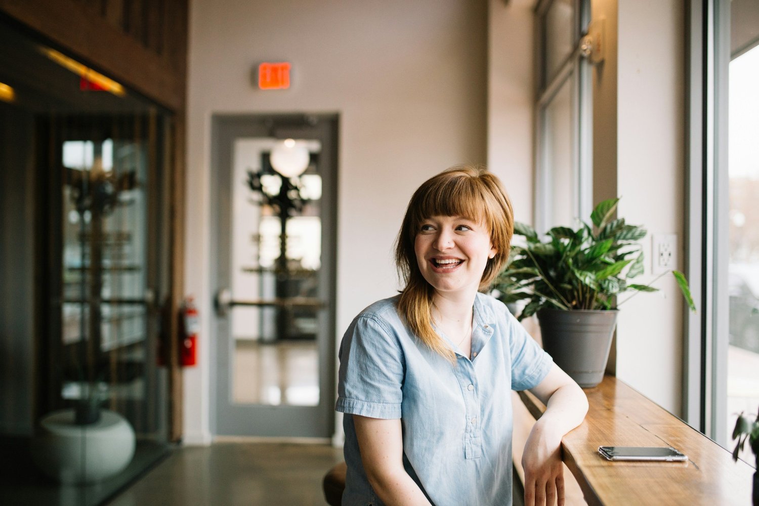 Here’s a clear and descriptive alt text you can use:  Alt text: "Smiling woman looking confident and relaxed, symbolizing overcoming fears and anxiety through therapy, representing mental health wellness and successful counseling.