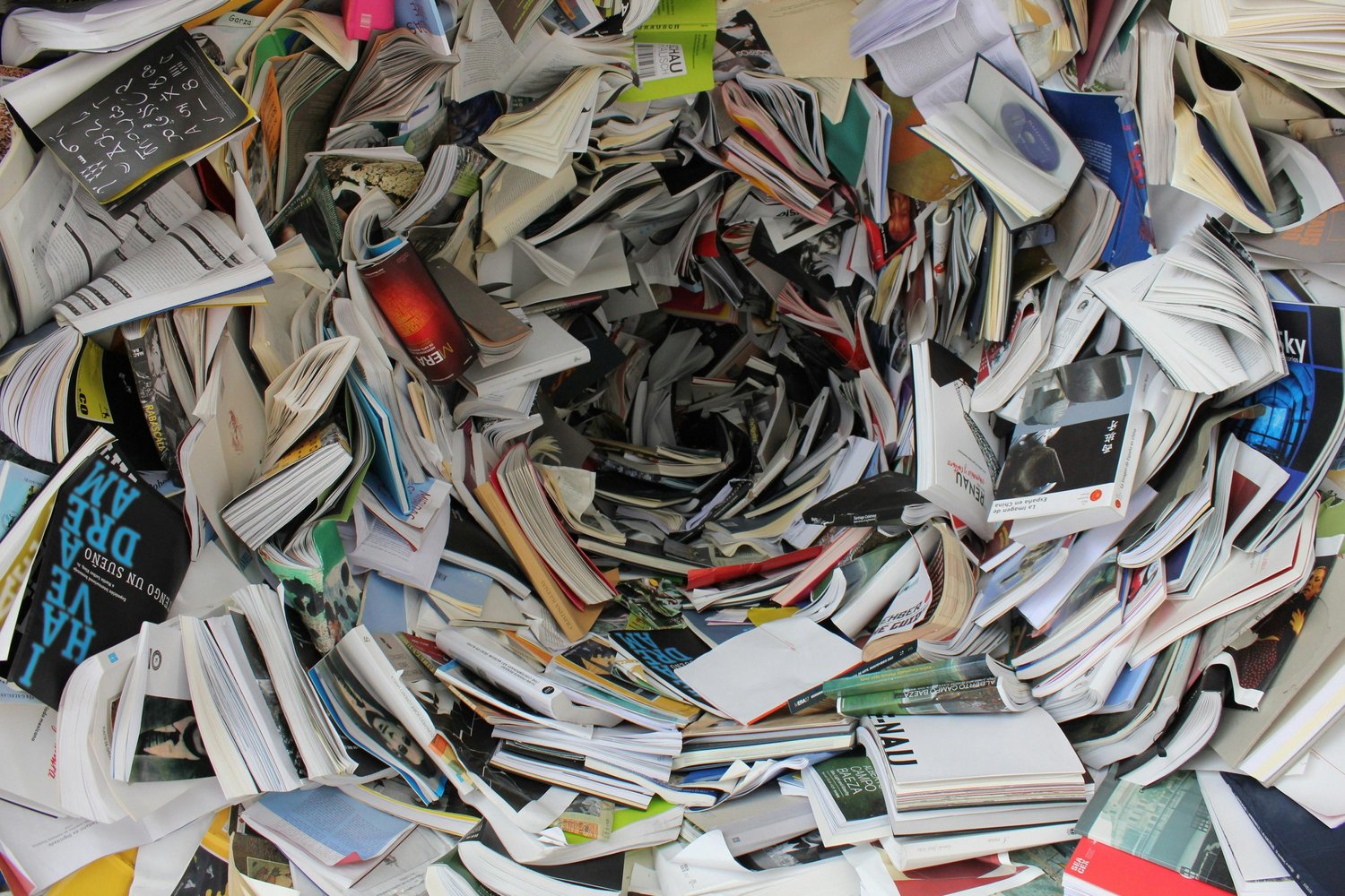 Pile of scattered papers and magazines